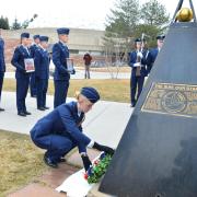 Air Force ROTC cadet leaves rose at shuttle memorial