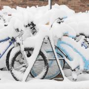 Snow-covered bikes