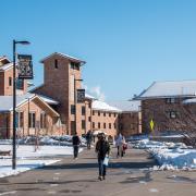 Campus community members walking on campus near Kittredge Central