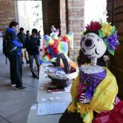 Students look at Spanish Heritage Language and Culture Day displays on campus