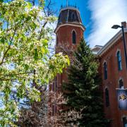 Old Main framed with spring blossoms