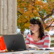 Student working at computer on campus