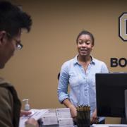 Student-employee works at front desk