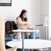 student studying on campus