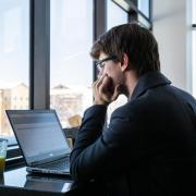 Person studying by window.