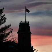 silhouette of Old Main building at sunset