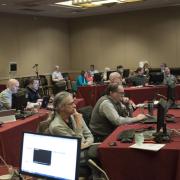 Participants sit at computers during Teach Access bootcamp