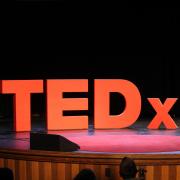 TEDxCU sign on stage