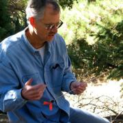 Professor Thomas T. Veblen performing research in forest