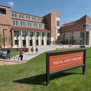 Campus community members walking outside of the Visual Arts Complex