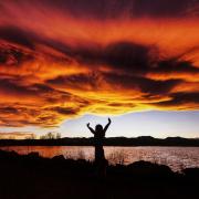 Silhouette of a person during sunset at Waneka Lake in Lafayette, Colorado. 