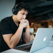 Person watching video on a laptop