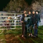 People take photos with the retiring Ralphie V ahead of Colorado's game against Washington on Saturday, Nov. 23, 2019. (Photo by Glenn Asakawa/University of Colorado)