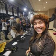 Friendly CU admissions staff hand out swag and help admitted students and their parents at Coors Events Center. Photo by Glenn Asakawa.