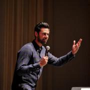 Hasan Minhaj speaks at Macky Auditorium. Photo by Glenn Asakawa.