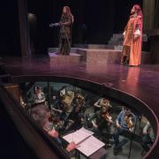 View of the stage and orchestra pit as College of Music students perform in the dress rehearsal for Ariodante. Photo by Glenn Asakawa.