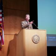 Emcee Bud Coleman at the podium