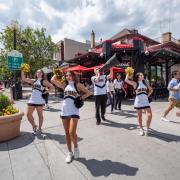 Cheerleaders pump up onlookers during CU on The Hill.