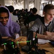 Electrical engineering major Nathan Tadele, left, and mechanical engineering major Ryan Cochran work on an assignment in a physics fiber optics class. Photo by Casey A. Cass.