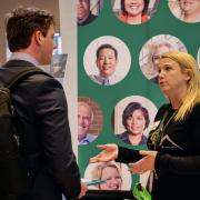 Recruiter speaks with finance student Michael Siegele. Photo by Glenn Asakawa.