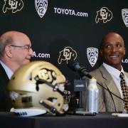 Chancellor Philip DiStefano, left, and Karl Dorrell smile during a press conference announcing Dorrell as the new head football coach at CU Boulder. (Photo by Casey A. Cass/University of Colorado)