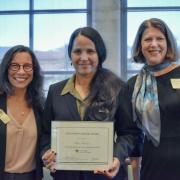 Awardee Mithi Mukherjee (center) with Vice Chancellor Michele Moses (left) and Vice Chancellor Ann Schmiesing (right)