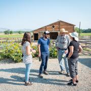 Aaron Treher and Molly McDermott speak with the Cargills at their farm. 