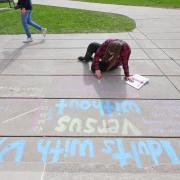 Laura Vacek, senior speech language pathology major, participates in the UROP Sidewalk Symposium. Photo by Casey A. Cass.