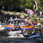 Tubers ride the Boulder Creek for Tube to Work Day 2018