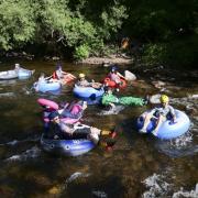 Tubers ride the Boulder Creek for Tube to Work Day 2018