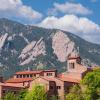 top of a campus building with Flatirons in the background