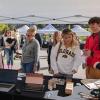 Campus community members visit a booth at the Take Care Fair