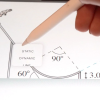 A hand holds a stylus above an iPad screen displaying a cartoon image of a skier on a hill. A dropdown window reads: "STATIC; DYNAMIC; LINE"