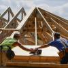 People building a home