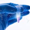 researcher holding a vial