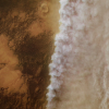Satellite image of the surface of Mars. Left half of the image is clear, while the right half is clouded in dust