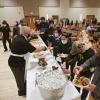 Administrators serving breakfast at the annual Staff Breakfast