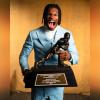 Travis Hunter with Heisman Trophy