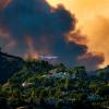 A DC10 Air Tanker is seen over the Woolsey Fire in California