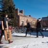 students walking on a snowy campus