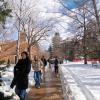 campus community members walking on a snowy campus