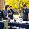 Student visits a Transfer Buffs table at a campus event