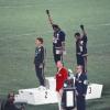 Olympic athletes raise their fists on the podium in 1968