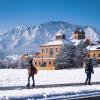 students walking on a snowy campus