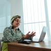 person engaging in a virtual meeting