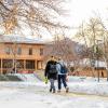 students walking on a snowy campus