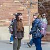two students talking outside