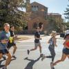 people running in a 5K on campus