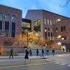 people walking near the CASE building at night