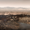 Computer illustration of a red and dusty planet with water flowing into a crater
